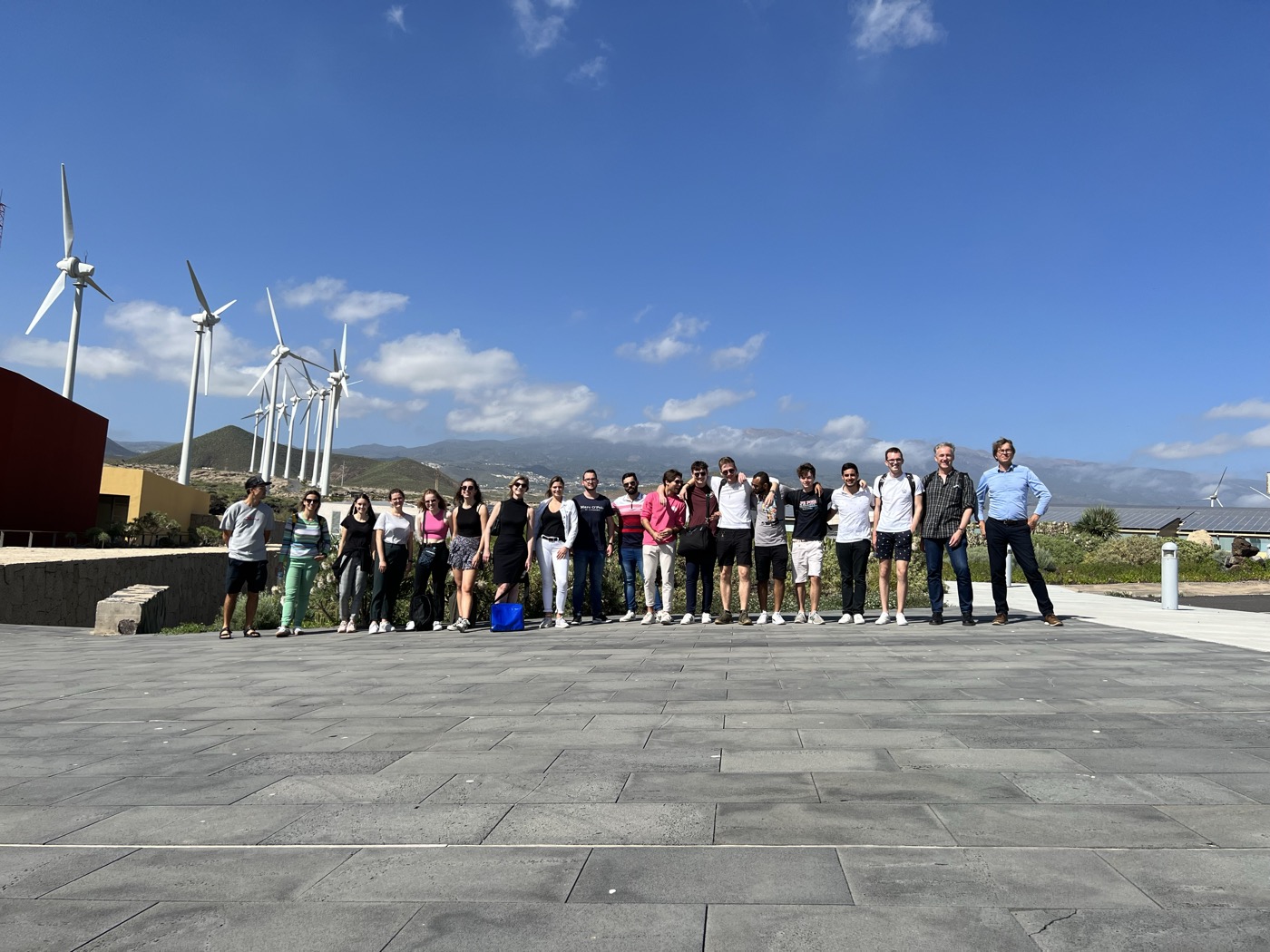 CIB 2022 group photo at ITER wind turbines